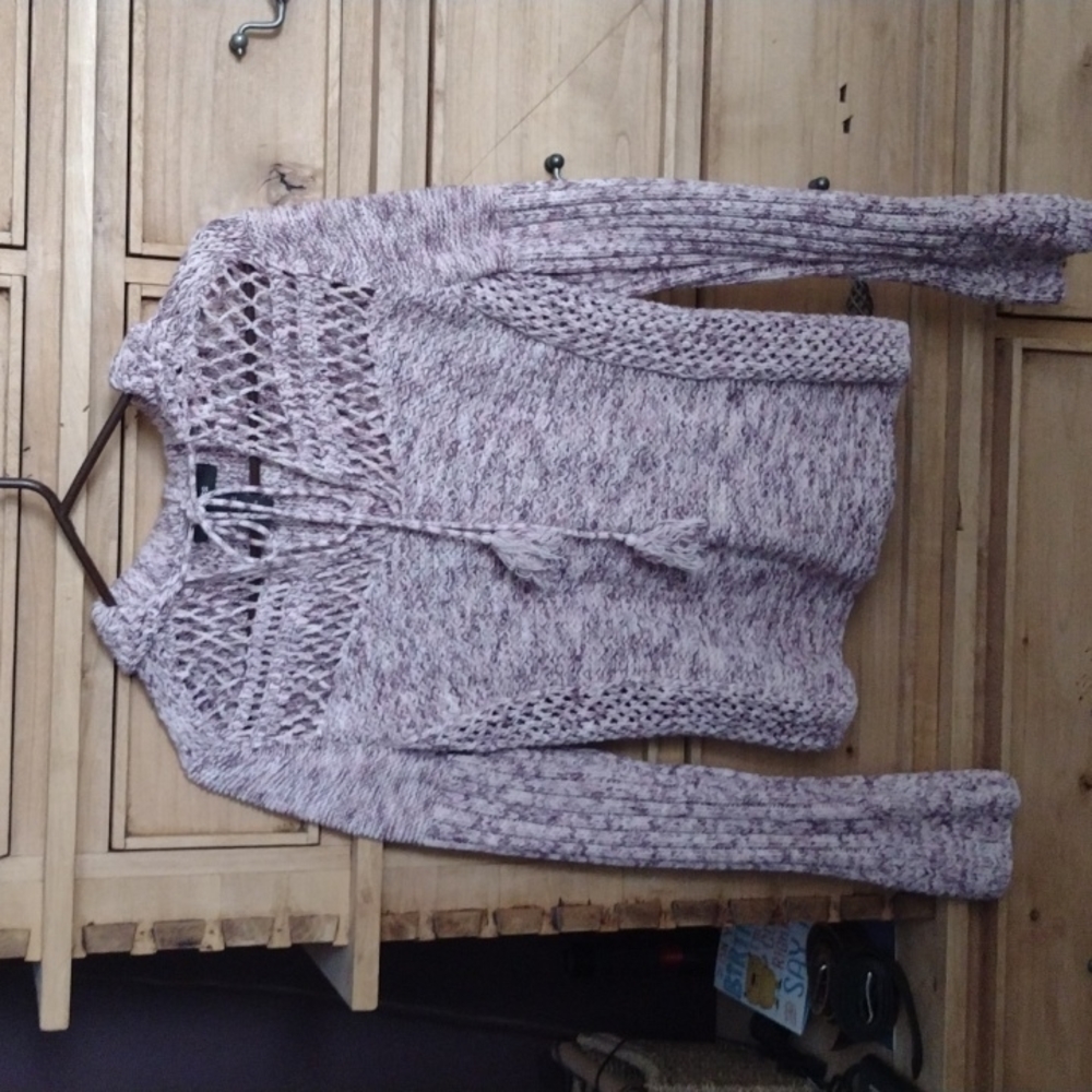 Cute pink sweater with a lot of detail